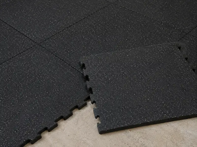 Interlocking rubber floor tiles