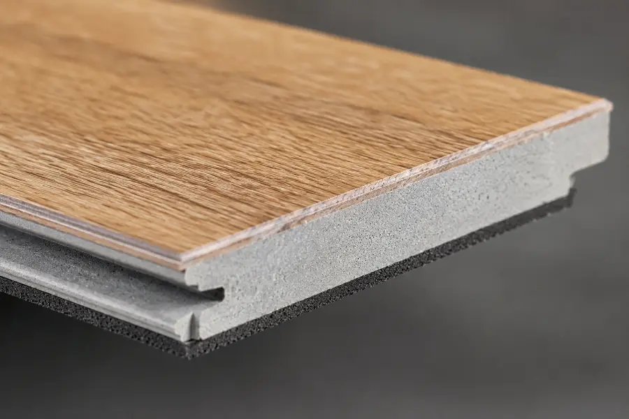 Close-up of an SPC flooring plank edge showing its rigid stone-composite core