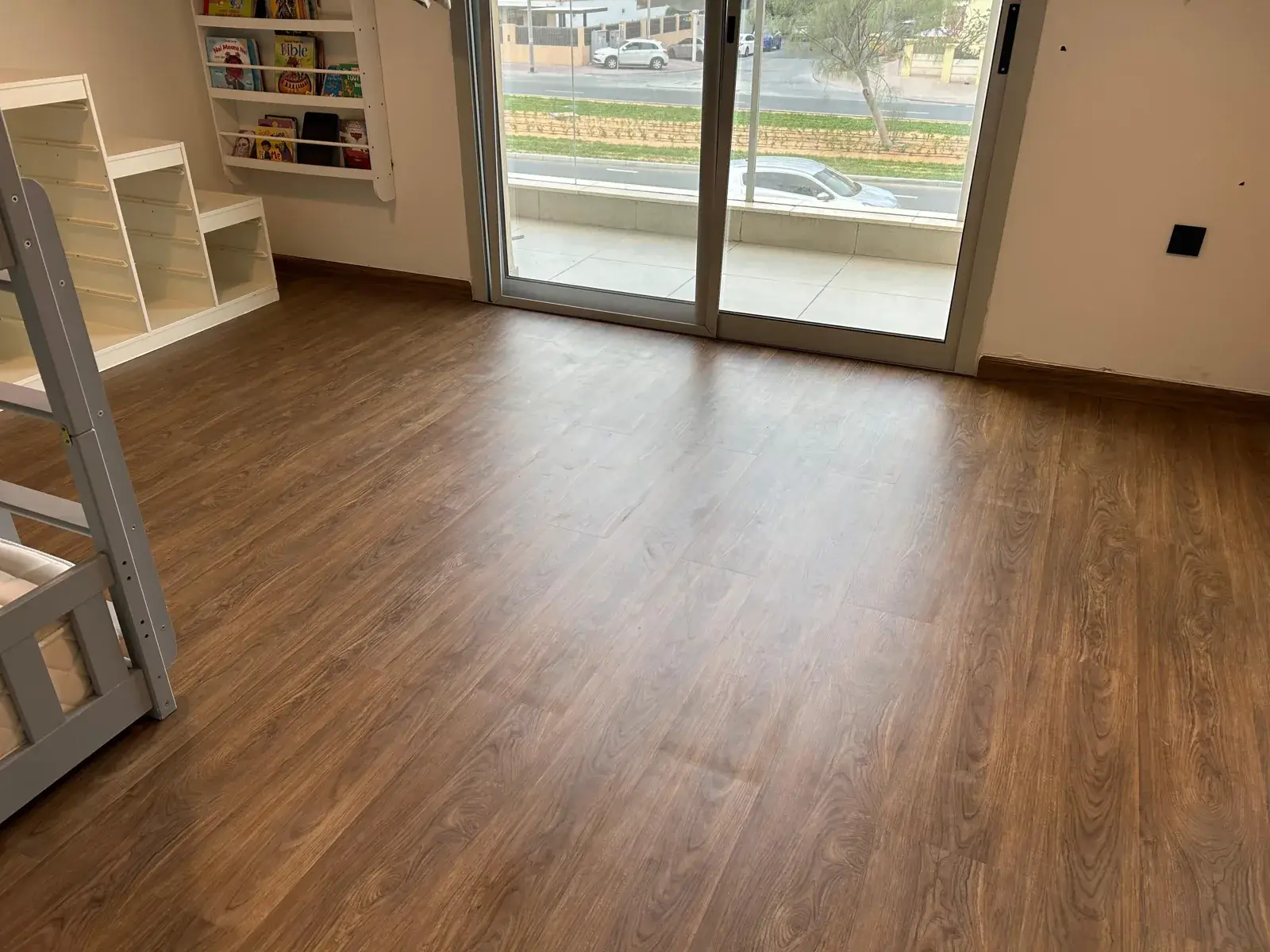 Brown SPC flooring in a villa bedroom with balcony, JVT District 8 Dubai