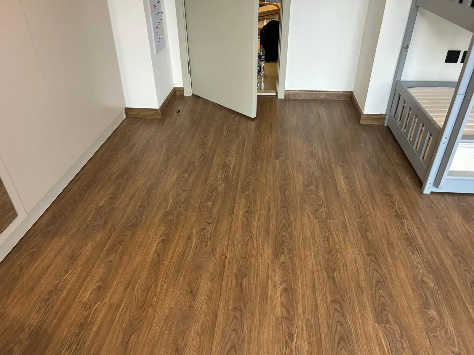 Brown SPC plank flooring in a villa kids' bedroom, JVT District 8 Dubai