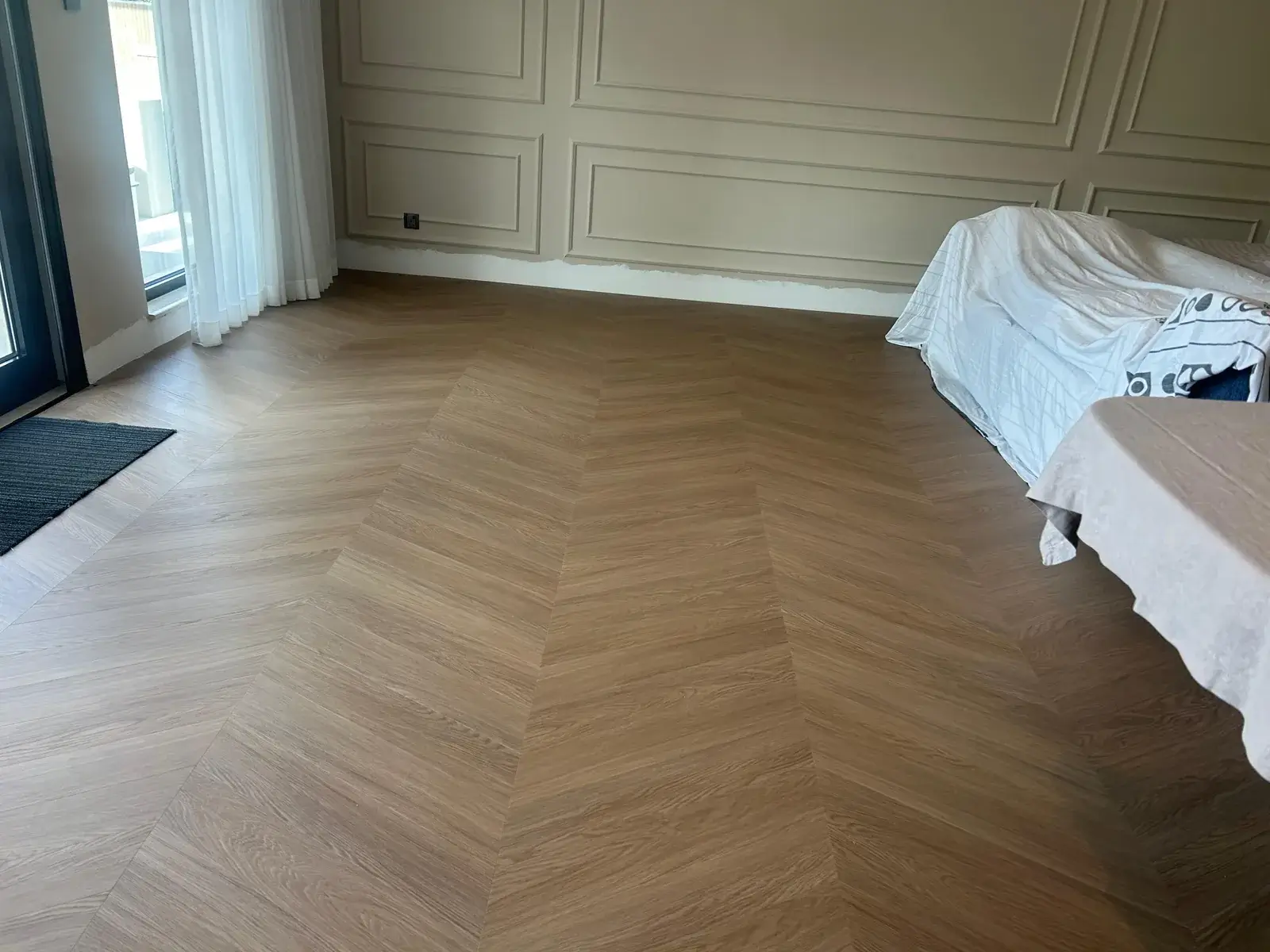 Chevron wood-look flooring running to a balcony door, Costa Brava DAMAC Lagoons Dubai