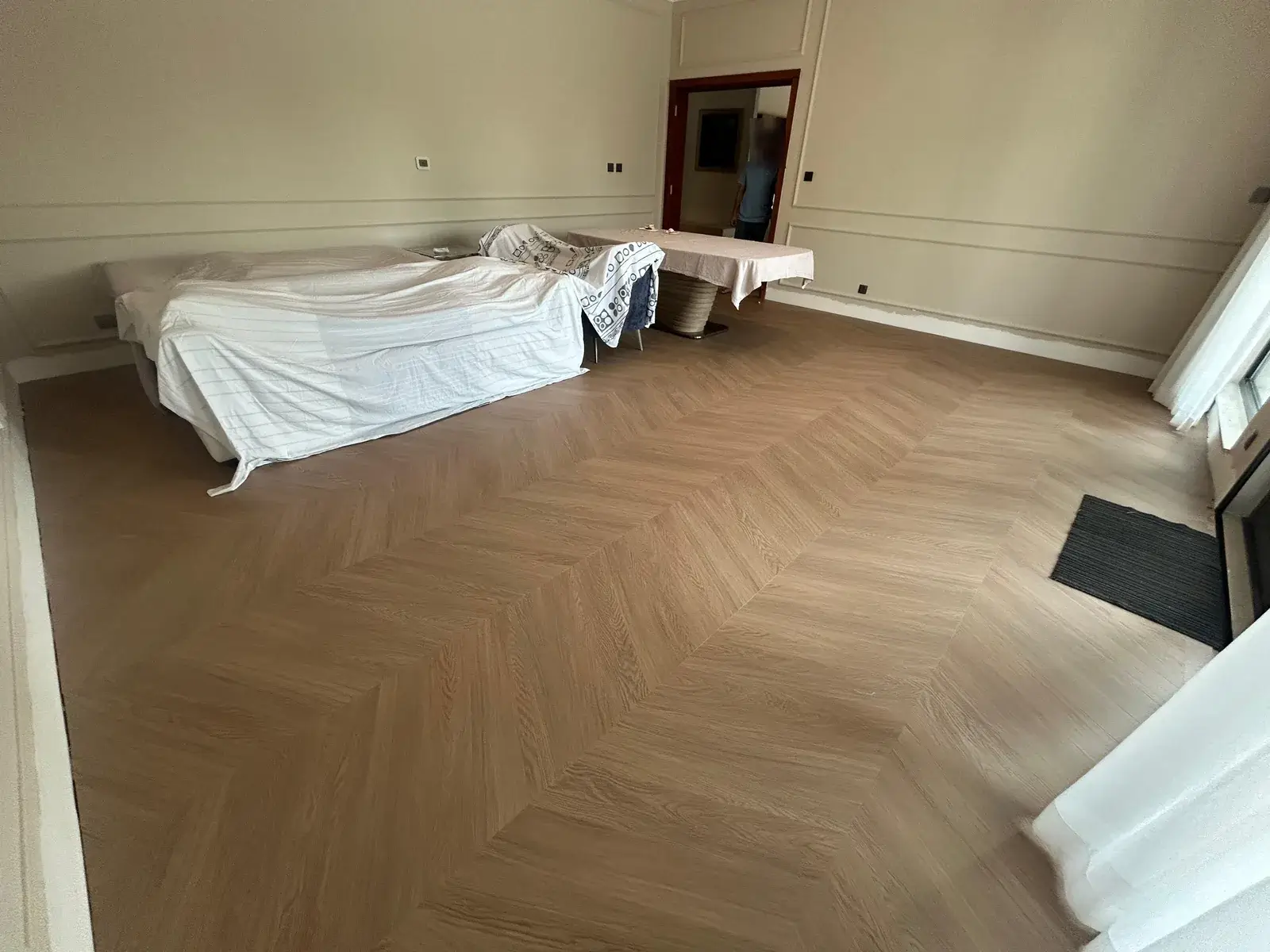 Chevron wood-look flooring across a living and dining area, Costa Brava DAMAC Lagoons Dubai