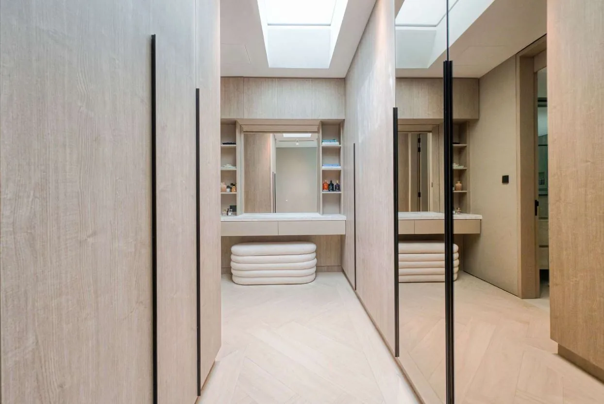 Chevron wood-look SPC flooring in a walk-in dressing room, Tilal Al Ghaf villa Dubai