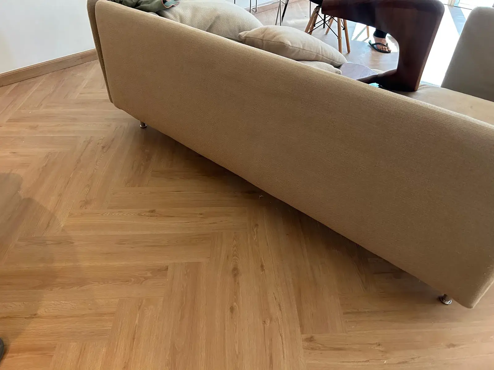 Herringbone SPC flooring in the living and dining area of a Valia Tower apartment, Dubai
