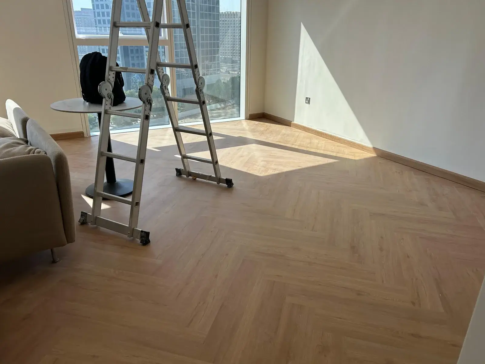 Herringbone SPC flooring in a Valia Tower apartment with Dubai Creek Harbour skyline view