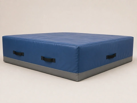 Thick soft landing crash mat, showing its depth from the side