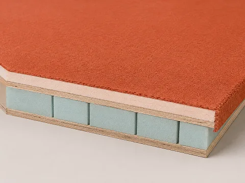 Section of a sprung gymnastics floor with a bonded carpet top surface