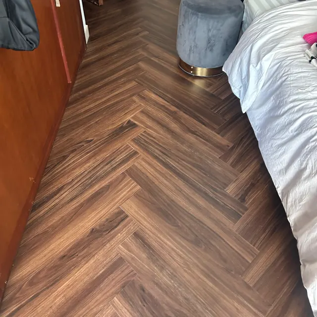 Herringbone LVT flooring in an apartment bedroom at Land Residence Complex, Dubai