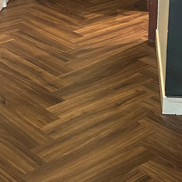 Herringbone LVT flooring in an apartment entrance hall at Land Residence Complex, Dubai