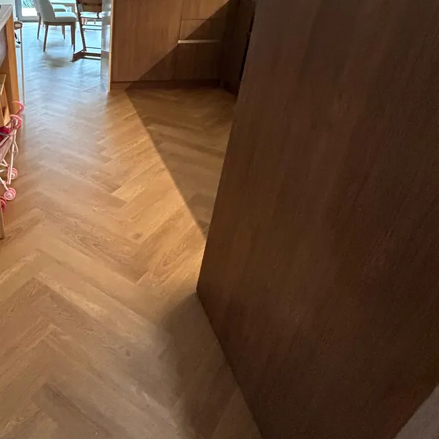 Herringbone LVT flooring running through a doorway towards the kitchen, The Springs villa Dubai