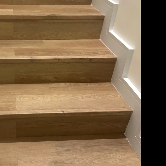 Stair treads and risers clad in the same LVT board with a matching nosing, The Springs villa Dubai