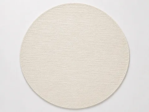 Cotton flatweave round area rug in a light tone