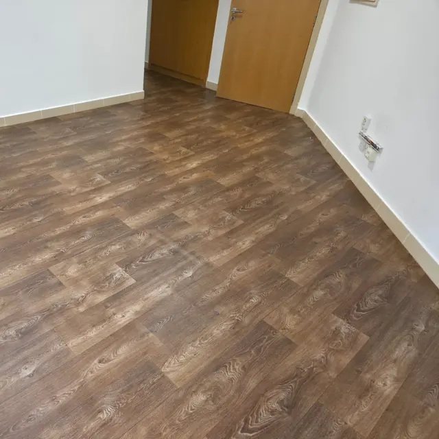 Wood-look sheet vinyl flooring in a bedroom at Y Tower, Al Reem Island, Abu Dhabi