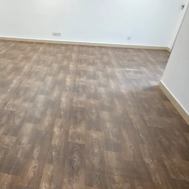 Wood-look sheet vinyl flooring in an empty room at Y Tower, Al Reem Island, Abu Dhabi