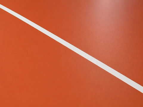 Continuous poured polyurethane sports floor surface in a solid colour with a matt finish