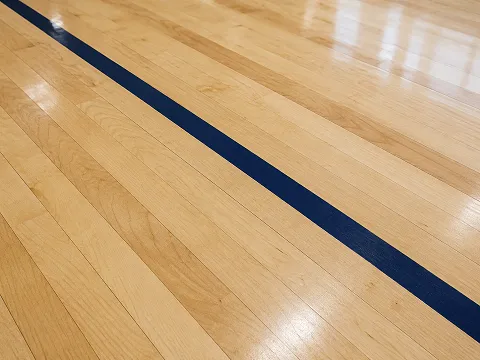 Maple sprung timber sports floor with a clear lacquered finish